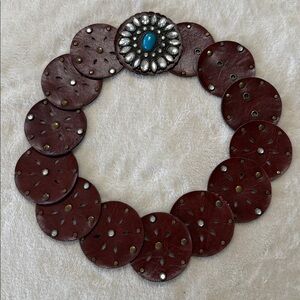 Adjustable wide hollow disc western belt with turquoise accents.